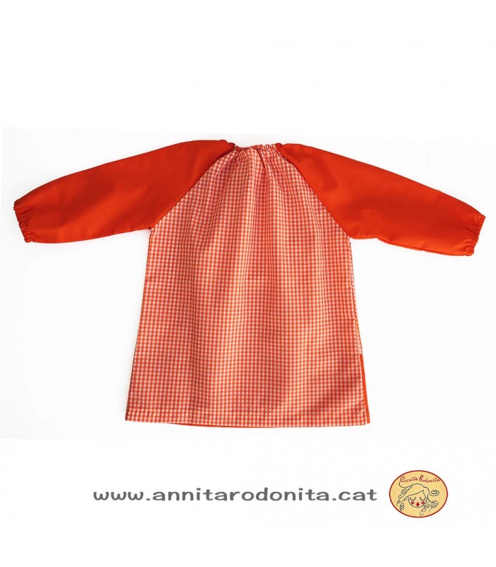 Bata taronja amb goma. Personalitzada amb el nom