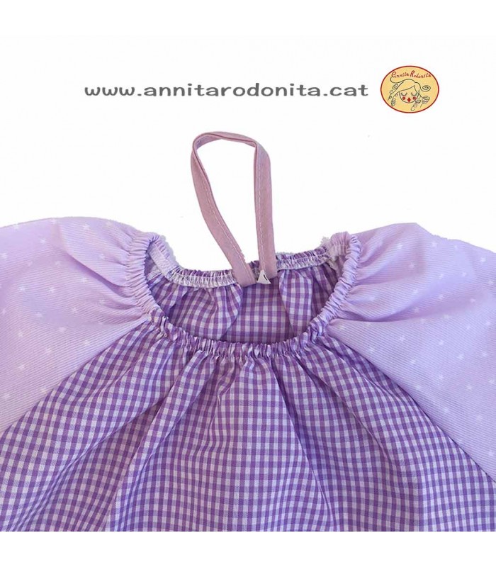 Bata lila estrelletes amb goma. Personalitzada amb el nom